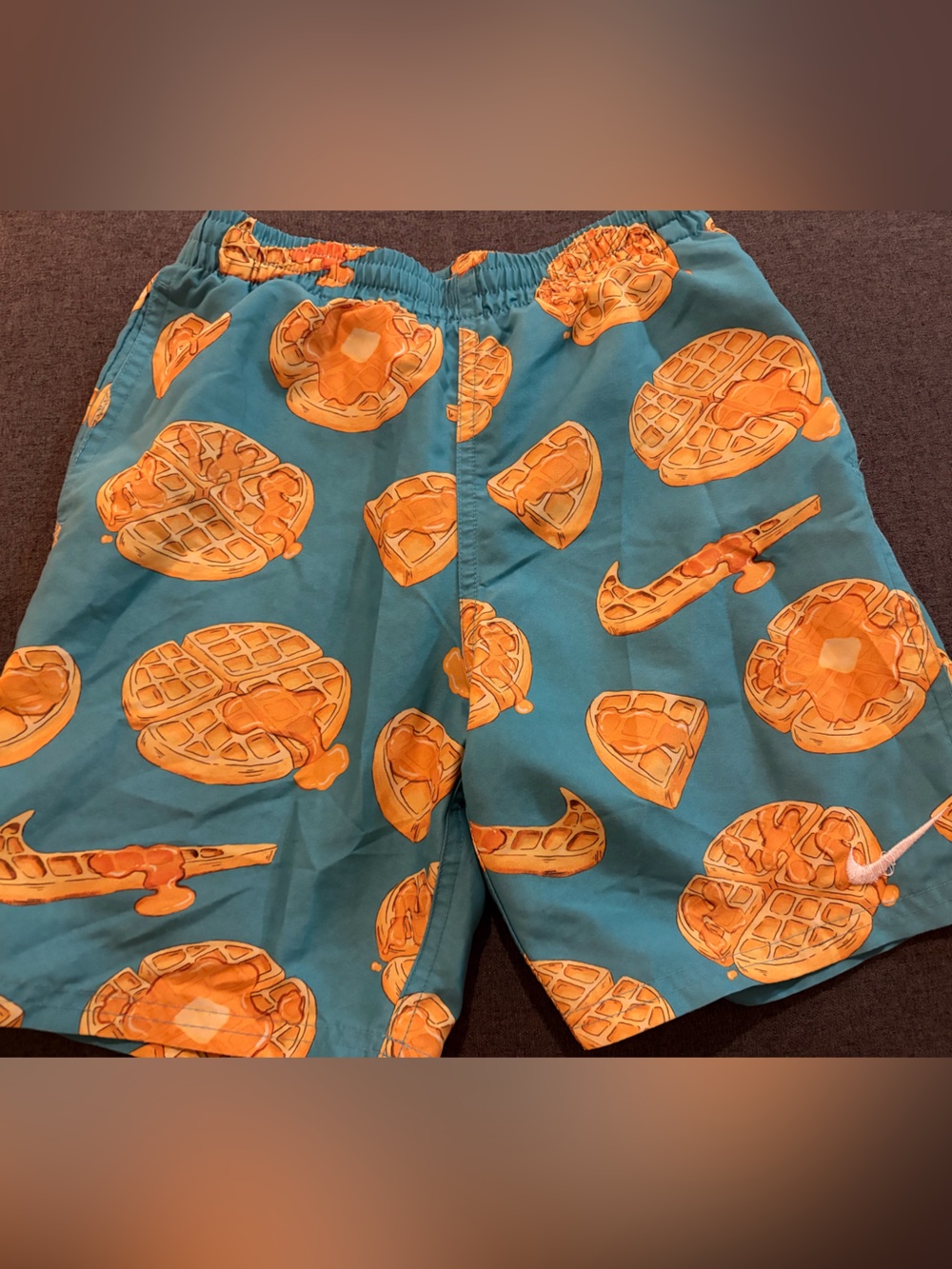 Nike Kids Teal Swim Trunks with Orange Waffle Print